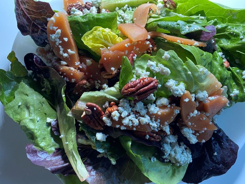 The Porter Beer Bar’s fall salad includes mixed greens, vanilla-poached quince, Gorgonzola cheese, pecans and ice wine vinaigrette. Bob Townsend for The Atlanta Journal-Constitution.