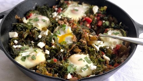Rethink comfort food by filling your skillet with greens and eggs. CONTRIBUTED BY KELLIE HYNES
