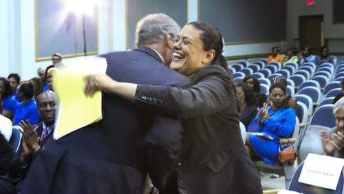 Georgia Tech President G.P. “Bud” Peterson (left) hugs Atlanta Public Schools Superintendent Meria Carstarphen (right) in August 2014, when an initiative was announced to grant admission to APS valedictorians and salutatorians. JOHN SPINK/JSPINK@AJC.COM