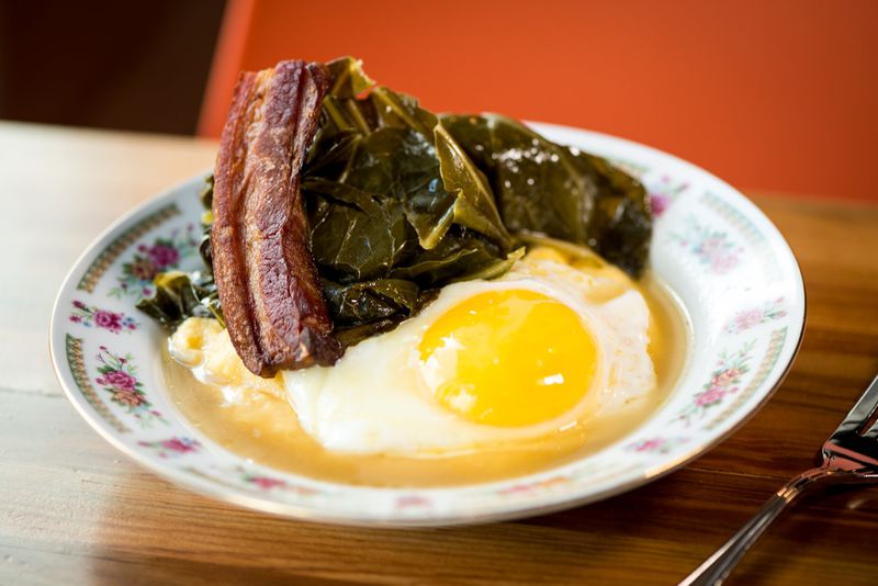 Mary Hoopa’s polenta with braised bacon, an egg, and collard greens. CONTRIBUTED BY MIA YAKEL