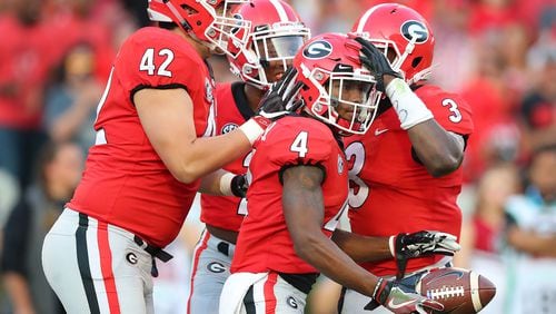 Georgia special teams players celebrate with Mecole Hardman after he downed South Carolina inside the five yard line on a punt during the second half of a NCAA college football game on Saturday, November 4, 2017, in Athens.    Curtis Compton/ccompton@ajc.com