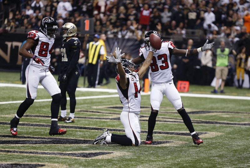 Atlanta Falcons wide receiver Eric Weems (14) celebrates his touchdown with wide receiver Harry Douglas (83) in the first half of an NFL football game against the New Orleans Saints in New Orleans, Sunday, Dec. 21, 2014. (AP Photo/Rogelio Solis) Atlanta Falcons wide receiver Eric Weems (14) celebrates his touchdown with wide receiver Harry Douglas (83) in the first half of an NFL football game against the New Orleans Saints in New Orleans, Sunday, Dec. 21, 2014. (AP Photo/Rogelio Solis)