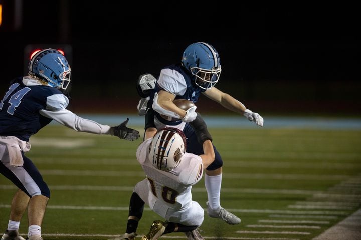 Cambridge's Cade Ellington (1) is tackled by Timothy Irons (10) during a GHSA high school football game between Cambridge and South Paulding at Cambridge High School in Milton, GA., on Saturday, November 13, 2021. (Photo/Jenn Finch)