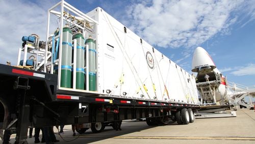 During an exercise earlier this year, a custom-built CBCS container is carried on a special trailer that allows the container to roll onto a device that raises the container to the aircraft’s main cargo floor. Source: Phoenix Air