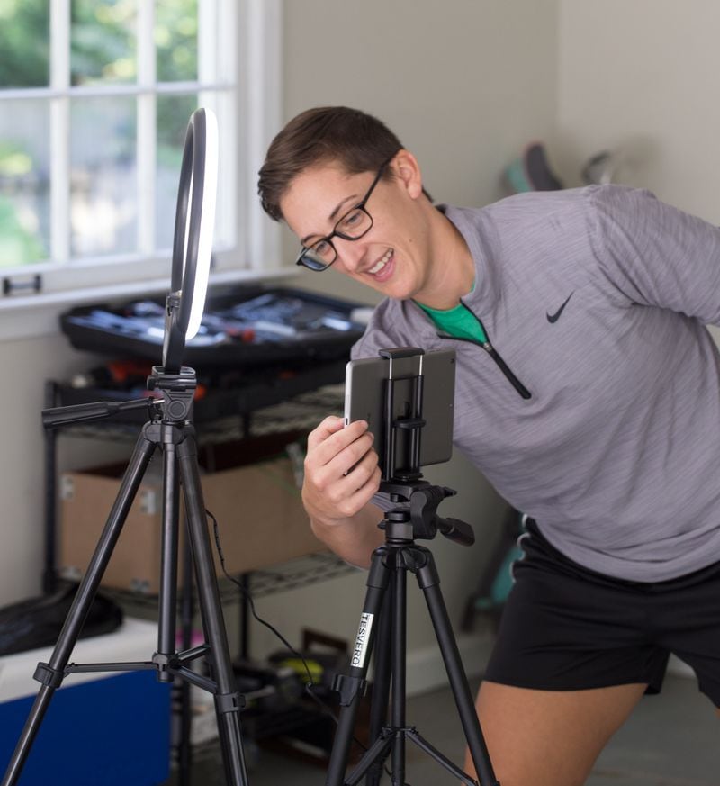 Springdale Park Elementary School teacher Jen Hagerty records physical education videos in her Marietta garage on Oct. 7, 2020. Hagerty has created a Mario Kart exercise game using a green screen and video-editing software. (Jenni Girtman for The Atlanta Journal-Constitution)