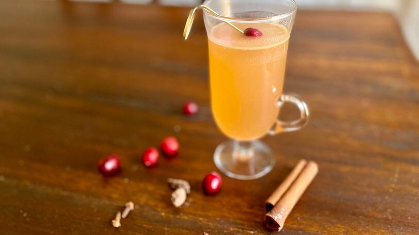 Southern Belle’s Kevin Bragg makes cranberry hot buttered rum using leftover cranberry sauce. Angela Hansberger for The Atlanta Journal-Constitution
