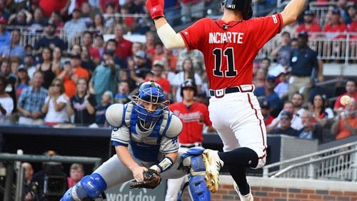 Ender Inciarte of the Braves scores a second-inning run but was hurt on the play. (Photo by Scott Cunningham/Getty Images)