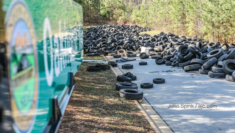 A man accused of dumping thousands of tires in neighborhoods across metro Atlanta has been arrested, police say.