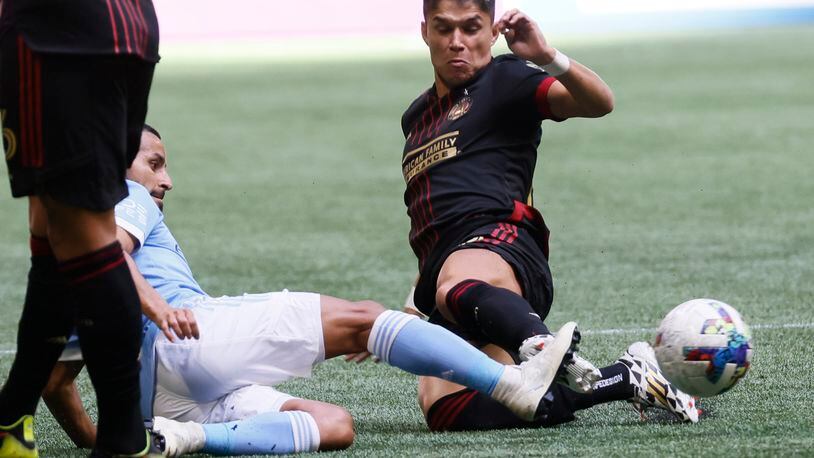 Atlanta United forward Luiz Araújo battles for the ball during the first half Sunday at Mercedes-Benz Stadium. (Miguel Martinez / miguel.martinezjimenez@ajc.com)