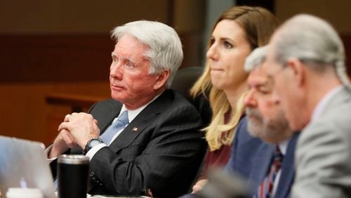 4/19/18 - Atlanta - Tex McIver, seated with his attorneys, watches the video of his police interview that the jury requested to see as they continued with their third day of deliberations today during the Tex McIver murder trial at the Fulton County Courthouse.   Bob Andres bandres@ajc.com