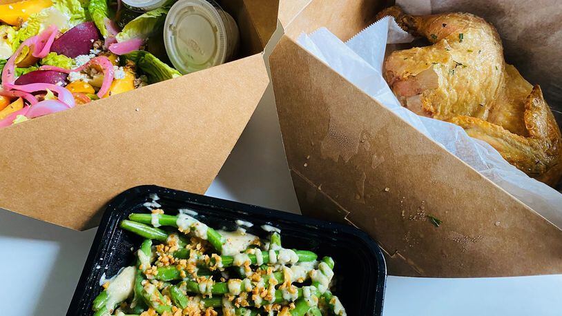 This takeout order of garlic green beans, Little Gem salad and roasted chicken is from Wonderkid. CONTRIBUTED BY BOB TOWNSEND