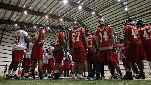 Falcons rookies gather under the lights of the "barn" with the weather forcing practice indoors for rookie minicamp on Saturday, May 4, 2013, in Flowery Branch. CURTIS COMPTON / CCOMPTON@AJC.COM