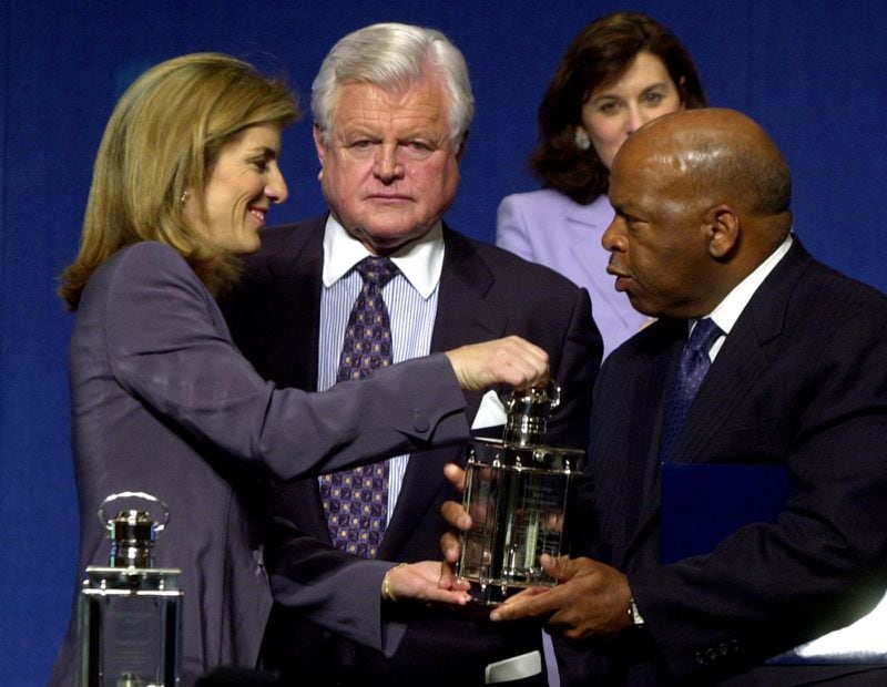 In 2001, John Lewis was awarded the Profile in Courage Award for Lifetime Achievement by Caroline Kennedy in honor of his leadership during the civil rights movement in the 1960s. Lewis' friend Sen. Edward Kennedy stands behind them. (Charles Krupa / AP)
