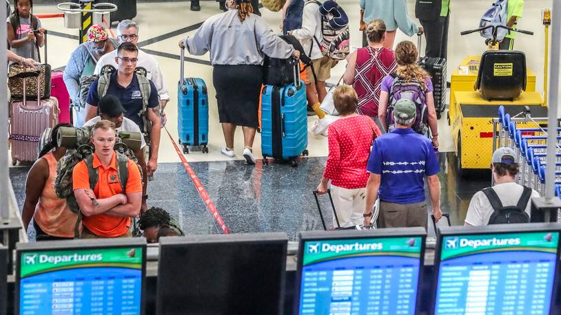 July 5, 2022 Hartsfield-Jackson International Airport: Airline travelers on the North Domestic Terminal made their way through Hartsfield-Jackson International Airport at the domestic terminal on Tuesday, July 5, 2022 after managing through a busy Fourth of July weekend for air travel with storms and cancellations, airlines face the challenge of navigating through the rest of a busy summer. Pilot unions, travelers and Atlanta-based Delta Air Lines had raised concerns about staffing issues and flight disruptions over the holiday weekend. Delta ended up canceling dozens of flights a day throughout the weekend, as did other major carriers as thunderstorms hit Georgia and the East coast. But the Independence Day weekend flight cancellations weren’t as severe as during Memorial Day weekend and some other nightmare travel days so far this summer. On Friday, the busiest day of the holiday weekend, Delta canceled 117 flights, or 3.9% of scheduled flights according to FlightAware.com. On Saturday, it canceled 81 flights, followed by 54 cancellations on Sunday and 41 cancellations on Monday. Fort Worth, Texas-based American Airlines and Delta have had the worst cancellation rates in the U.S. airline industry in recent weeks, according to FlightAware.com data. (John Spink / John.Spink@ajc.com)



