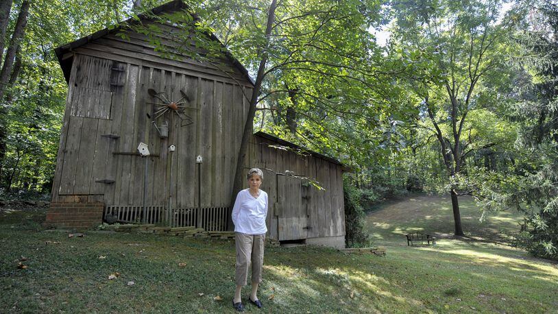 FILE PHOTO: Wylene Tritt, 84, poses for a portrait behind her family’s barn in Marietta, Georgia, on Monday, October 3, 2016. The barn was built by Tritt’s father-in-law, Will Tritt in the 1940’s. (DAVID BARNES / DAVID.BARNES@AJC.COM)