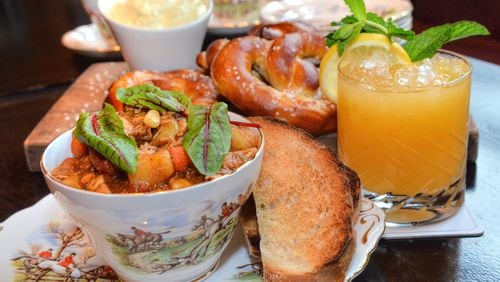 Kentucky Burgoo, Bourbon Slush and Beer Cheese with Bavarian Pretzels, shared by executive chef (and Kentucky native) Michael Patria of the Four Seasons Hotel in Atlanta. (Photo by Chris Hunt/Special)