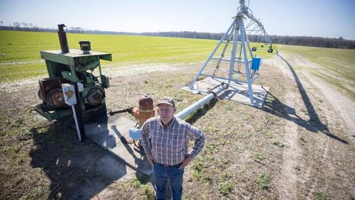 Ray Davis, a Bulloch County farmer, stands near one of his wells and pivots that irrigate part of his 1,100 acres on Wednesday, Feb. 21, 2024,  near Brooklet, Ga. Davis is concerned that a plan to pump groundwater to supply Hyundai's Metaplant EV factory will compromise local wells like his. (AJC Photo/Stephen B. Morton)