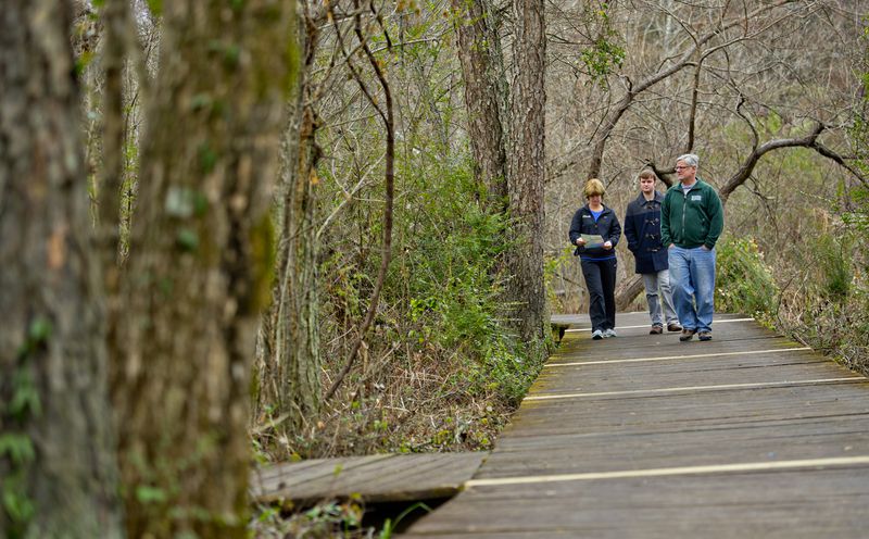 Philomena Strenger (left), her son Anton and husband Carl hike along the River Boardwalk Trail at the Chattahoochee Nature Center in Roswell on Saturday, December 27, 2014. JONATHAN PHILLIPS / SPECIAL