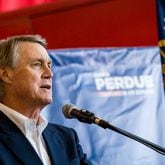 U.S. Sen. David Perdue holds a rally in November at Peachtree DeKalb Airport with South Carolina U.S. Sen. Tim Scott.  (Jenni Girtman for The Atlanta Journal-Constitution)