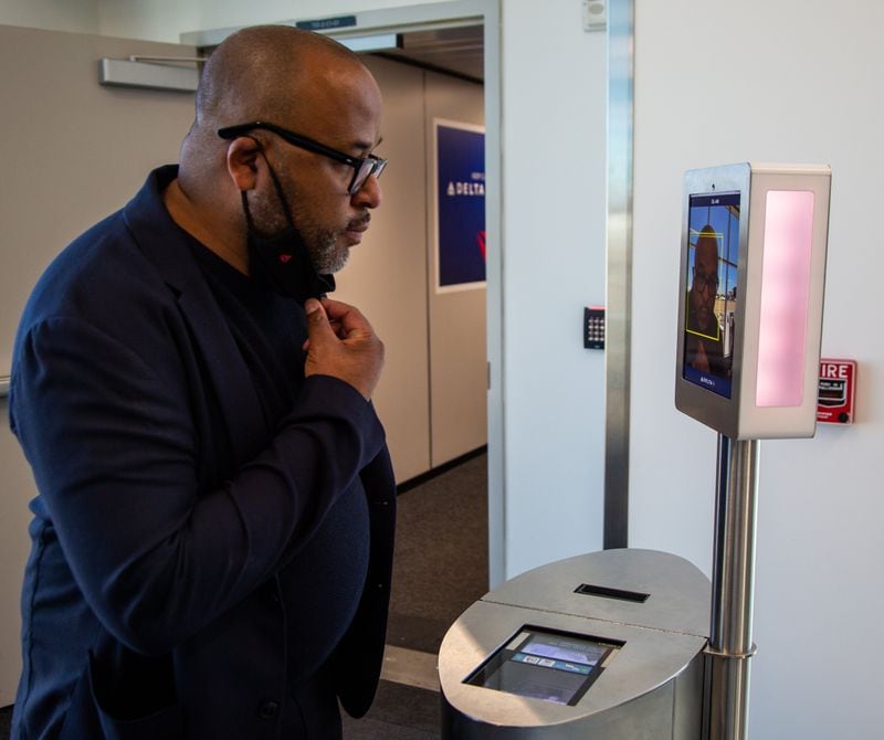 Byron Merritt, vice president, brand experience design, demonstrated the facial recognition gate check-in system during a tour of Delta's  facial recognition system at Hartsfield-Jackson International Airport. PHIL SKINNER FOR THE ATLANTA JOURNAL-CONSTITUTION.