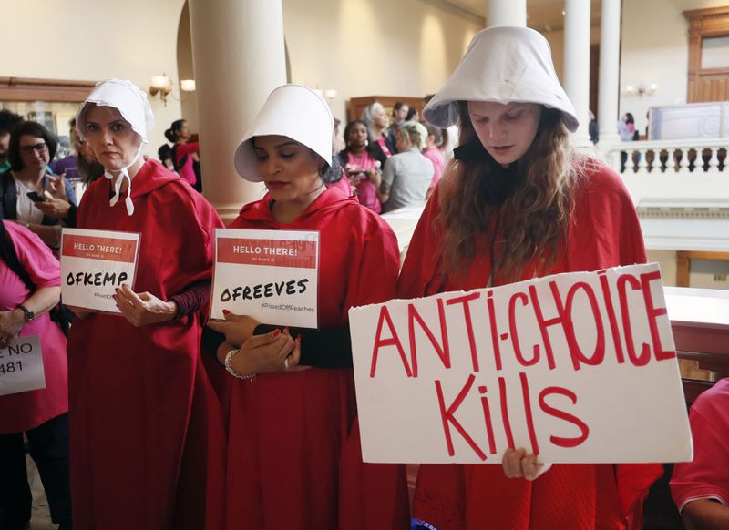 March 14, 2019 - Atlanta - Georgia members of the Handmaid Coalition were protesting HB 481 outside the Capitol today.   A Senate hearing was held Thursday for the "fetal heartbeat bill."  Advocates on both sides are expected to fill the Capitol as the committee debates the bill that would outlaw most abortions after six weeks.    Bob Andres / bandres@ajc.com