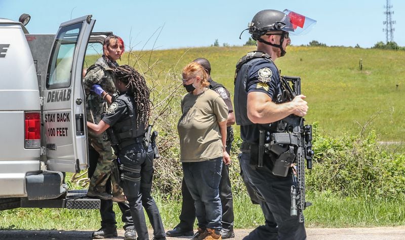 Police make arrests Tuesday, May 17, 2022, at encampment of opposition to the massive training center planned for Atlanta’s police officers and firefighters. (John Spink/ John.Spink@ajc.com)