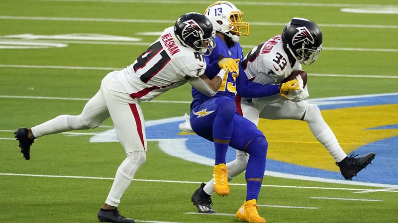 Atlanta Falcons cornerback Blidi Wreh-Wilson (33) intercepts a pass intended for Los Angeles Chargers wide receiver Keenan Allen (center) late in the fourth quarter Sunday, Dec. 13, 2020, in Inglewood, Calif. (Ashley Landis/AP)