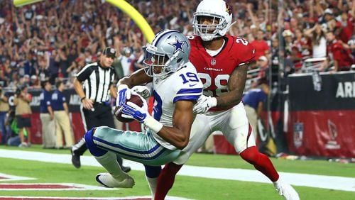 Cowboys wide receiver Brice Butler (19) catches a pass for a touchdown against Cardinals cornerback Justin Bethel.