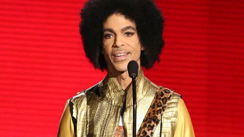 FILE - In this Nov. 22, 2015, file photo, Prince presents the award for favorite album - soul/R&B at the American Music Awards in Los Angeles. Prince died at his home in Chanhassen, Minn. on April 21, 2016 at the age of 57. (Photo by Matt Sayles/Invision/AP, File)