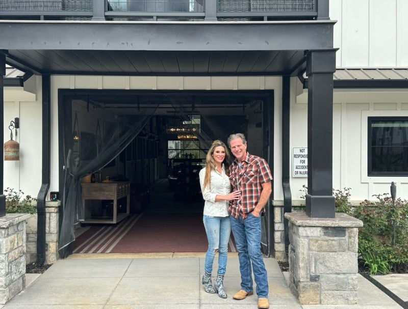 Karen and Jim Rosenberger are standing in front of their renovated barn. It was converted into a wine tasting room for their farm winery but the couple has since revised plans and say they will no longer open the tasting room to the public.
