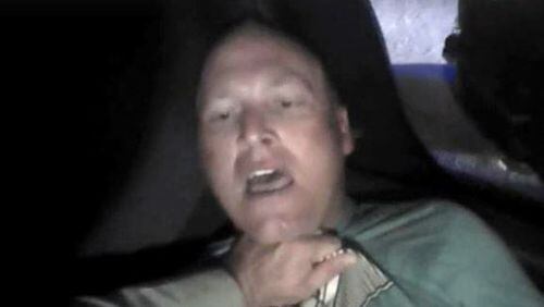 In the last minutes of his life, Chase Sherman, 32, struggles with a Coweta County deputy in the back of his family's rented SUV. Image captured from video from deputy's body camera.