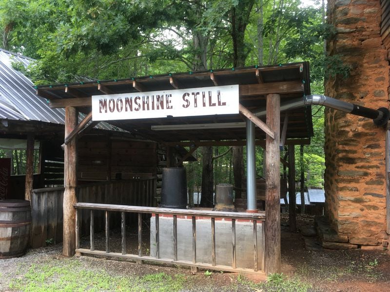 The Pioneer Village at the Georgia Mountain Fair offers a step back in time. Visitors can tour structures such as a cabin dating to 1842 and one dating to 1890 and a corn crib, general store, hammer mill and moonshine still. JENNIFER BRETT / JBRETT@AJC.COM