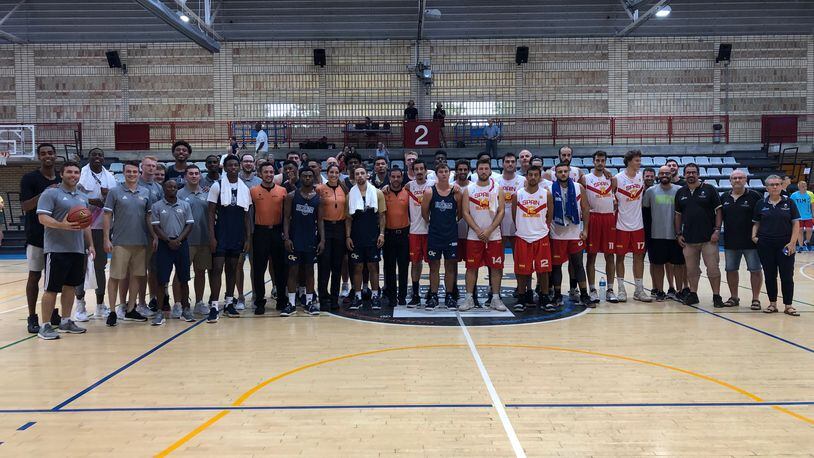 The Georgia Tech basketball team and staff with the team of Spanish professionals after one of their exhibition games in Barcelona. Former Tech captain Quinton Stephens, who is playing professionally in Spain, is behind coach Josh Pastner on the left. (Photo courtesy Mike Stamus, Georgia Tech)