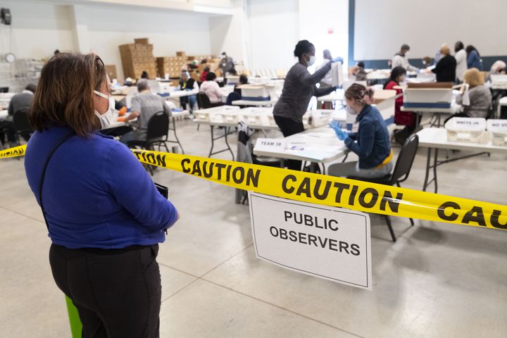 An observer looks on during a Cobb County hand recount of Presidential votes on Sunday, Nov.15, 2020, at the Miller Park Event Center in Marietta. (JOHN AMIS FOR THE ATLANTA JOURNAL-CONSTITUTION)