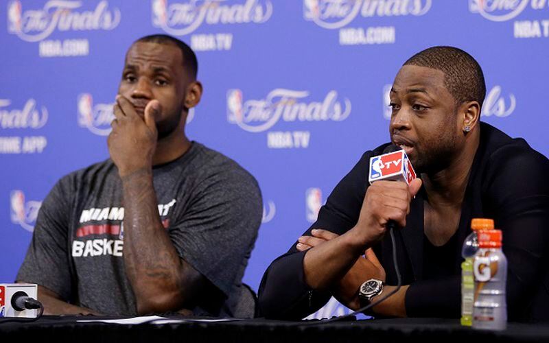 Miami Heat guard Dwyane Wade, right, and LeBron James, speak during the post-game news conference after Game 3 of the NBA basketball finals, Wednesday, June 11, 2014, in Miami. The Spurs defeated the Heat 111-92. (AP Photo/Lynne Sladky) I tried to dislike these guys. Couldn't do it. (Lynn Sladky/AP)
