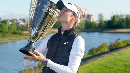 Nelly Korda poses for a picture after she won the Mizuho Americas Open golf tournament, Sunday, May 19, 2024, in Jersey City, N.J. (AP Photo/Seth Wenig)