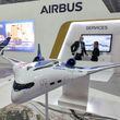 This picture taken on November 14, 2021 shows a mockup of one of the blended-wing body concepts of the "Airbus ZEROe" zero-emissions hybrid-hydrogen aircraft, at the booth of a European multinational aerospace corporation Airbus SE, during the 2021 Dubai Airshow in the Gulf emirate. (GIUSEPPE CACACE/AFP via Getty Images/TNS)
