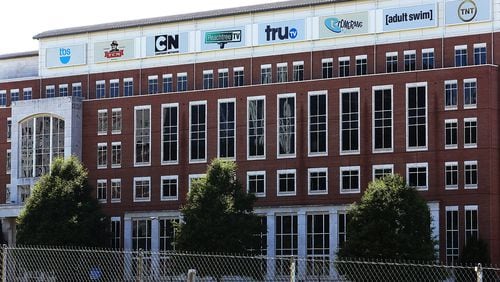 Turner Broadcasting, headquartered in Atlanta, is part of the $85 billion acquisition that was ruled on Tuesday.