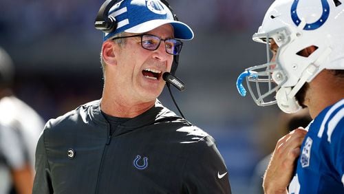Indianapolis Colts head coach Frank Reich talks to his quarterback Andrew Luck on the sidelines in the first half of their game on Sunday, Sept. 30, 2018.