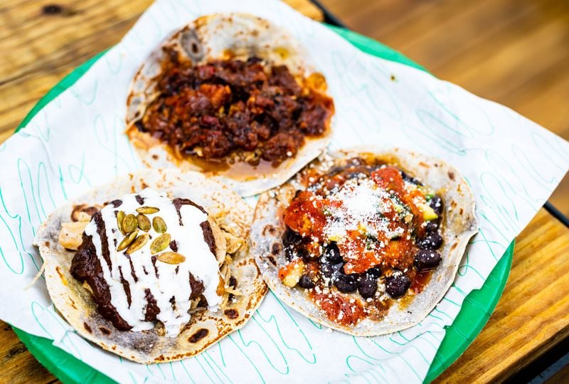 Tacos from Supremo include (clockwise from top) al pastor, black bean and mole poblano. CONTRIBUTED BY HENRI HOLLIS