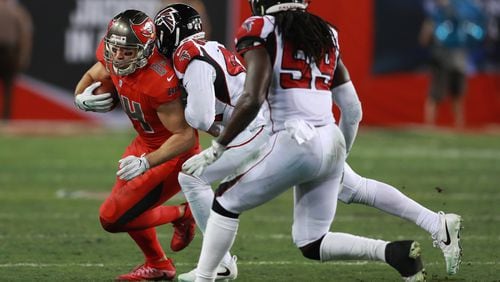 Tampa Bay Buccaneers tight end Cameron Brate (84) is chased donw by Atlanta Falcons linebacker Vic Beasley Jr. (44) and linebacker De’Vondre Campbell (59) during an NFL football game Thursday, Nov. 3, 2016, in Tampa, Fla. (Jeff Haynes/AP Images for Panini)