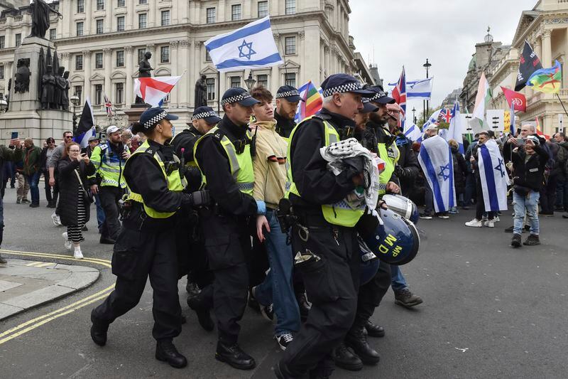Police arrest a Pro-Palestinian protester during a demonstration in London, Saturday, April 27, 2024.