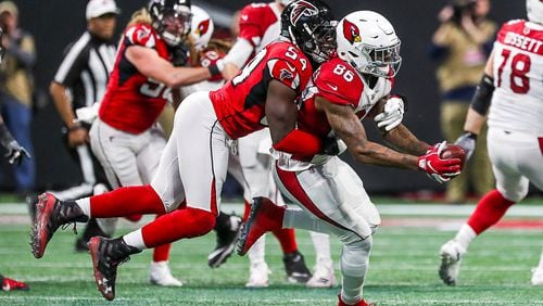 12/16/2018 -- Atlanta, Georgia -- Atlanta Falcons linebacker Foye Oluokun (54) tackles Arizona Cardinals tight end Ricky Seals-Jones (86) after completing a catch during the second half the game at Mercedes-Benz Stadium in Atlanta, Sunday, December 16, 2018.  The Atlanta Falcons beat the Arizona Cardinals, 40-14. (ALYSSA POINTER/ALYSSA.POINTER@AJC.COM)