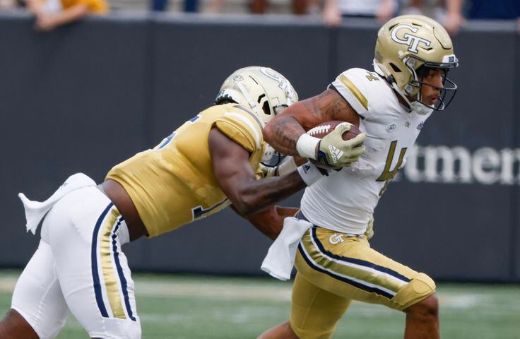 Dontae Smith breaks free for a nine-yard run in the first quarter during Georgia Tech's spring football game in Atlanta on Saturday, April 15, 2023.   (Bob Andres for the Atlanta Journal Constitution)