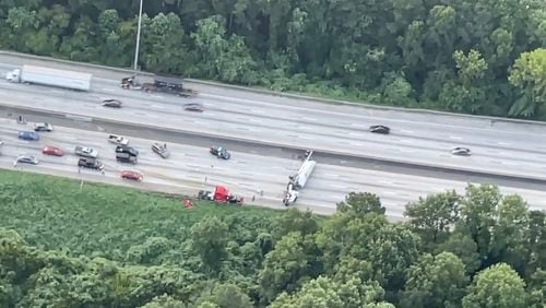 This overturned big rig shut down I-285/southbound north of Highway 166 on Monday, August 9th, 2021. Atlanta Fire Department did not arrive until an hour later, because motorists blocked the right emergency lane. Credit: Smilin’ Mark McKay, WSB Skycopter.