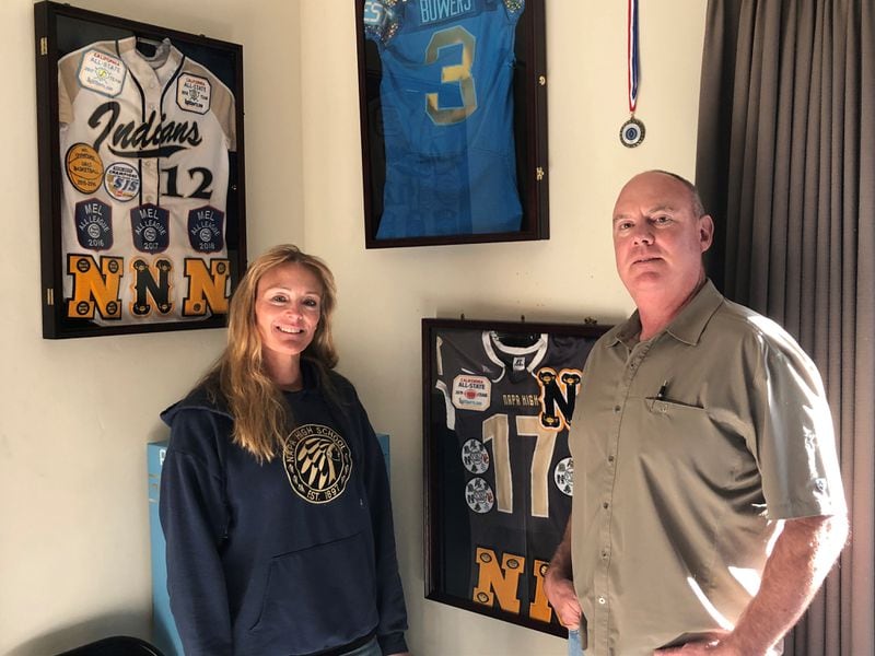 The parents of Georgia tight end Brock Bowers - DeAnna (left) and Warren Bowers - and the corner of their Napa, Calif., home dedicated to the athletic exploits of their son and daughter. (Photo by Steve Hummer)