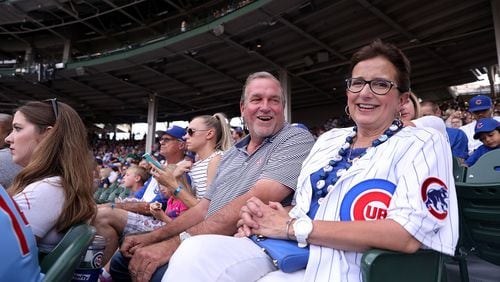 John Hendricks has a laugh with his wife, Ann Marie Hendricks, as the couple watches their son, Chicago Cubs starting pitcher Kyle Hendricks, as he faces the St. Louis Cardinals in the first inning of a game at Wrigley Field in Chicago on Thursday, July 19, 2018.  (Chris Sweda/Chicago Tribune/TNS)