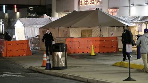 Portable medical tents are set up outside a Philiadelphia hospital. Pregnancy and deliveries are creating care challenges during the pandemic, and African American women are said to be especially at risk. (Elizabeth Robertson/The Philadelphia Inquirer/TNS)
