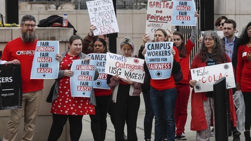 A group of college graduate students called the United Campus Workers of Georgia held a rally at Liberty Square across from the the state Capitol Wednesday to demand higher wages and other benefits from the University System of Georgia. BOB ANDRES / BANDRES@AJC.COM