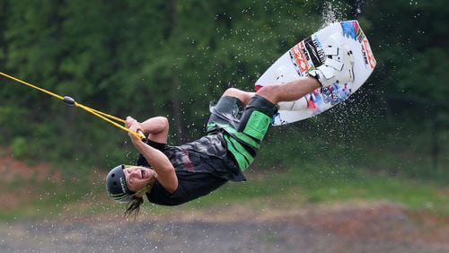 Terminus Wake Park, the first part of the sports complex to open, held a Liquid Force Free for all Monday with free riding, demo boards, food, and instruction. Here, wakeboard team member Tom Fooshee tries out one of the jumps. BOB ANDRES / BANDRES@AJC.COM